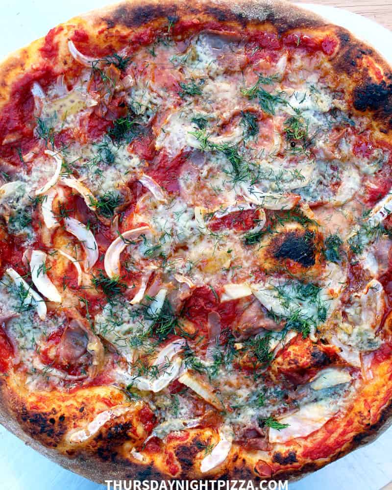 Fennel Pizza with Gorgonzola, Prosciutto, and Hot Honey, overhead