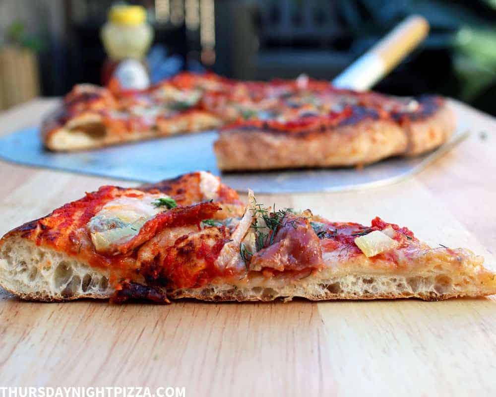 Fennel Pizza with Gorgonzola, Prosciutto, and Hot Honey, sliced