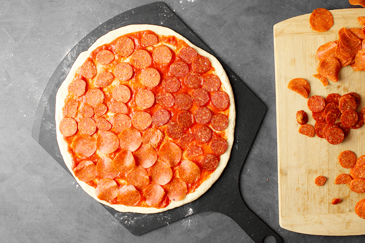 baking stone pepperoni pizza before baking