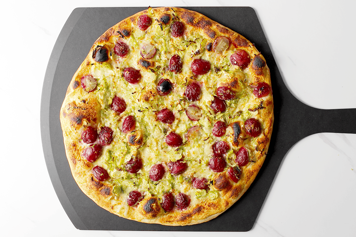 brussels sprout and grape pizza after baking