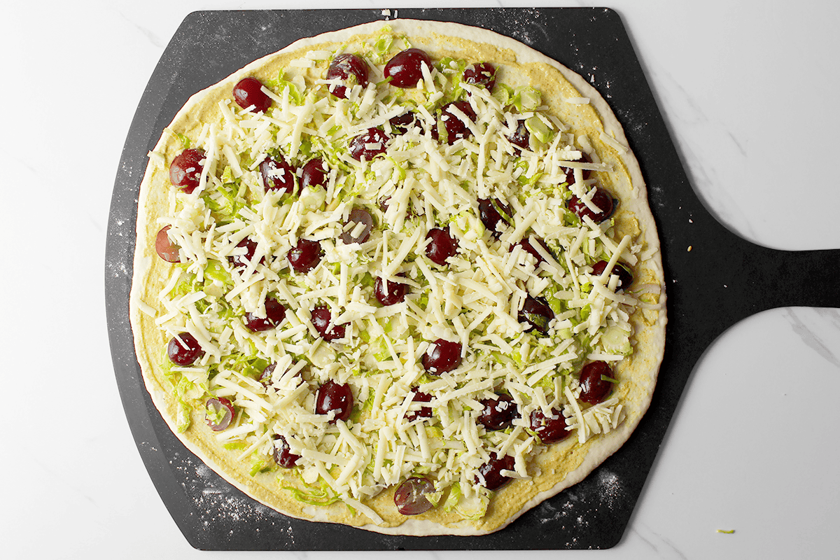 brussels sprout and grape pizza before baking