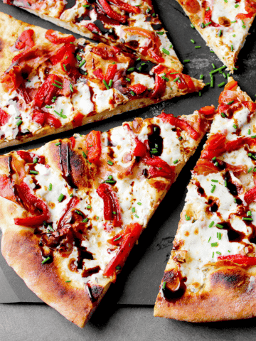prosciutto pizza slices on peel