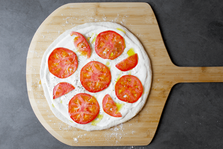 topping the pizza