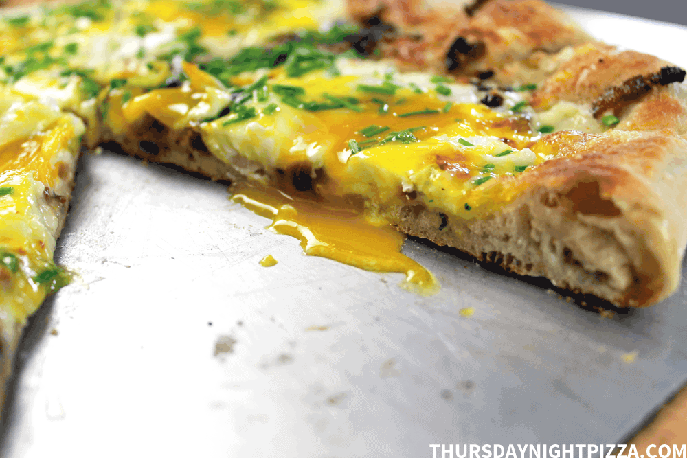 Bacon, Egg, and Cheese pizza with oozy egg yolks